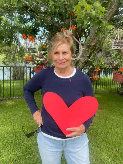 The author in her backyard, using the heart for story illustration.