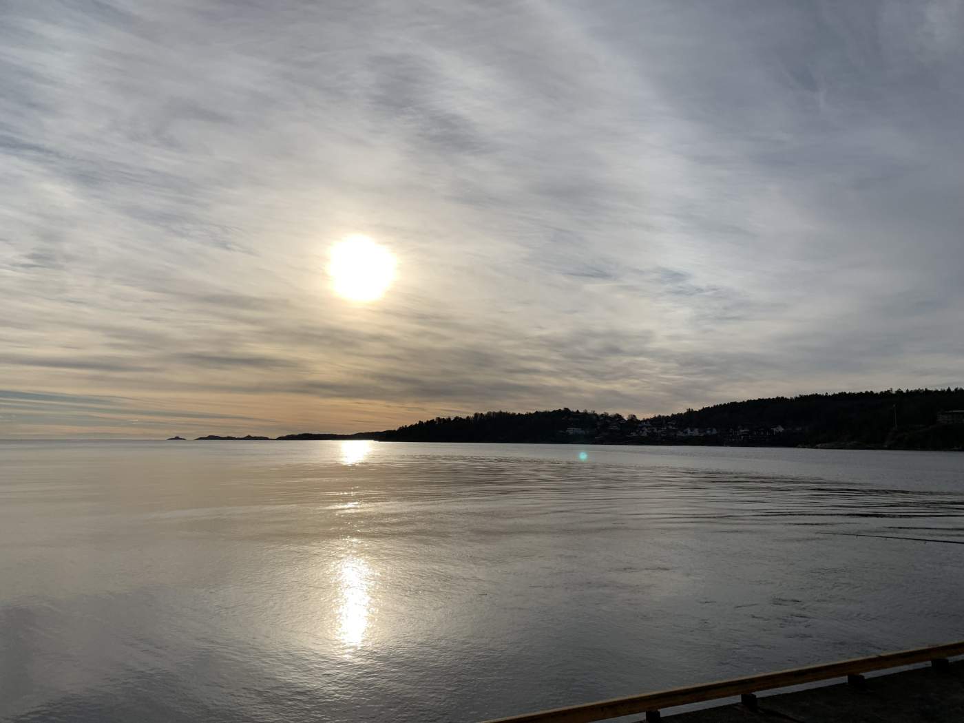 Gorgeous sunrise over the ocean with mountains in the distance.
